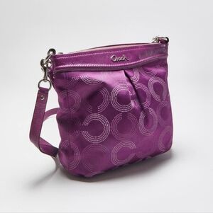 Coach Ashley Dotted Op Art Hippie Bag in a berry color.
